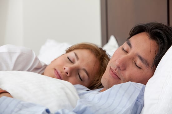 Beautiful  couple sleeping at their house